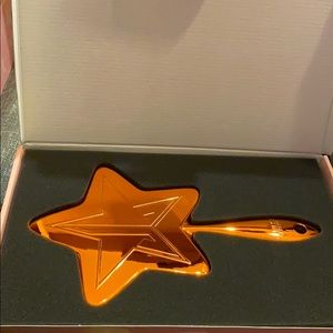 Orange chrome Jeffree Star hand mirror